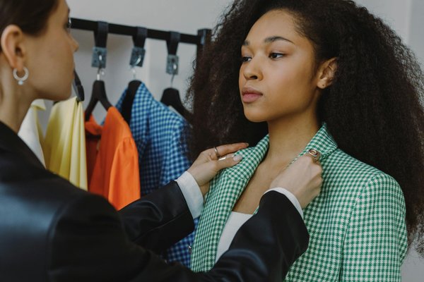 What are the best ways to style a classic trench coat for various seasons?